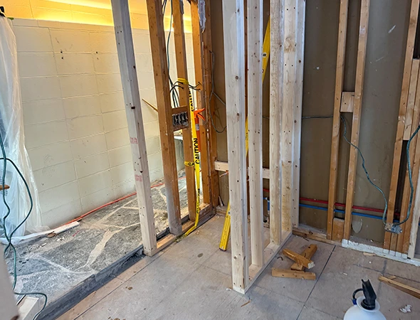 Professional wood wall framing and structural stud installation for a residential construction project in Burlington, VT.