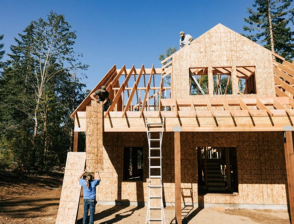 Local framing contractors from Kennison Construction installing premium structural wood framing for a new home in Montpelier, VT.